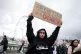 SIDING WITH PALESTINE: A woman protester spells it out on a 