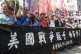 Protesters in Taipei hold a banner reading, ‘American warm