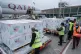 Workers in Nairobi, Kenya, receive boxes of the Moderna coro