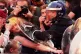 A punk protester feels the pressure during a march for strik