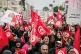 Demonstrators march with Tunisian flags during a rally again