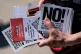 RESIST AND REFUSE: An anti-deportations activist distributes