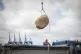 A boulder is loaded onto the Greenpeace ship, the Esperanza 