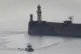 A Border Force vessel brings a group of people thought to be