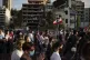 People march in honor of the victims of the last week's expl