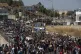 Migrants take part in a rally near Mytilene town, on the nor