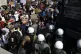 Police block the road as migrants protest near Mytilene town