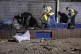 Israeli police inspect the damage at the site hit by a rocke