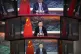 Video screens show Chinese President Xi Jinping as he delive