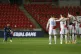 Arsenal's Alexandre Lacazette, left, takes a knee in support