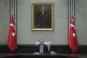Turkey's President Recep Tayyip Erdogan, backdropped by a pa
