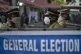 Indian policemen guard at a vote counting center for the sta