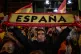 People react outside the Vox party headquarters in Madrid, S