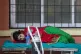 A COVID-19 patient waits to receive oxygen outside an emerge