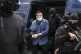 European Parliament member Ioannis Lagos leaves a police van