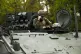 Belgian military sit in a tank at the entrance of the Nation