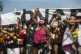 Demonstrators protest against the government's response in c