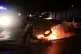A protester blocks a main road with burning tyres in downtow