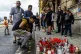 A man lighting up candle in Teplice, Czech Republic, in the 