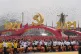 Attendees wave Chinese flags during a ceremony at Tiananmen 