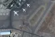 A satellite photo of people on the tarmac at Kabul Internati