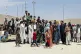 Hundreds of people gather outside the international airport 