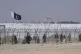 Pakistan and Taliban flags flutter on their respective sides