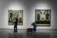 A worker cleans near an exhibit by Danish conceptual artist 