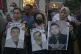 Protesters carry posters with pictures of Palestinian prison