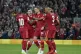 Liverpool's Jordan Henderson (centre) celebrates after scori