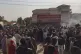 People burn tires and block a street during a protest in Kha