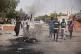 People burn tires during a protest a day after the military 
