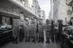 Security forces block a road after dispersing a protest agai