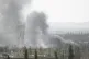Smoke rises in the countryside of Damascus, Syria, on Saturd