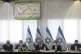 Israeli Prime Minister Naftali Bennett, center, speaks at th