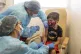 Nurses inoculate a boy against Covid-19 in Uruguay. 'Making