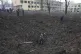 Ukrainian soldiers and emergency employees work at the side 