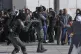 Israeli security forces point their guns at Palestinians dem