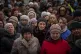 Ukrainians wait for a food distribution organised by the Red