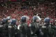 Riot police watch Liverpool fans during the Champions League