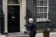 Prime Minister Boris Johnson waves after reading a statement