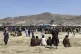 Hundreds of people gather near a US Air Force C-17 transport