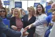 Liz Truss (centre) meets supporters as she arrives to attend