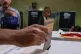 oters cast their ballot at a polling station in Rome, Sunday