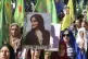 Kurdish women hold portraits of Iranian Mahsa Amini, during 