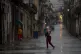  pedestrian crosses an empty street during the passing of Hu