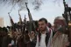 Armed Houthi fighters attend the funeral procession of Houth