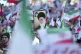 A man holds up a poster of Iranian Supreme Leader Ayatollah 