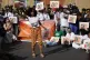 Demonstrators participate in a Kick Big Polluters Out protes