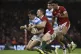 Argentina's Emiliano Boffelli, left, is tackled Wales' Georg